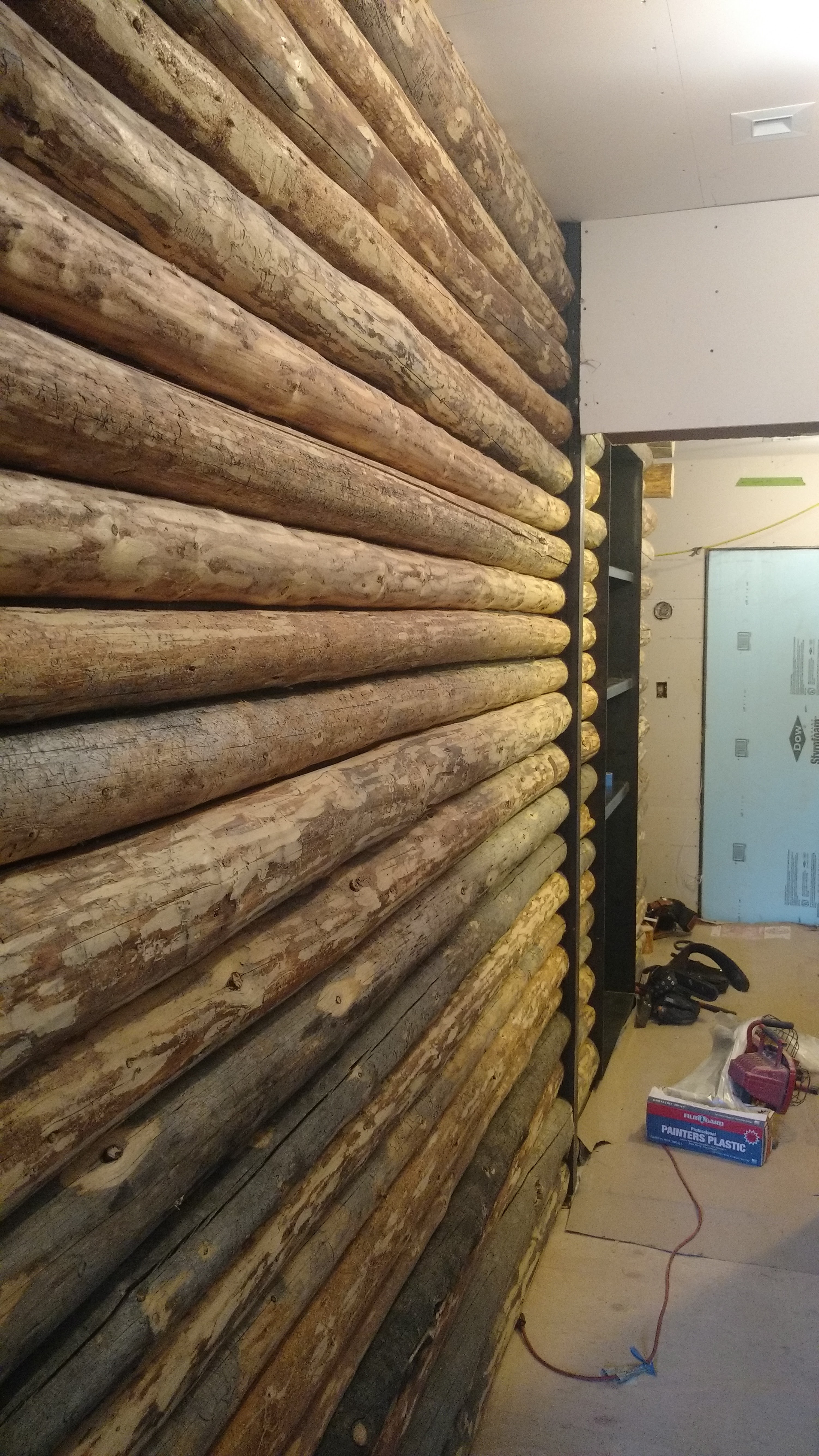 custom log wall panel installation