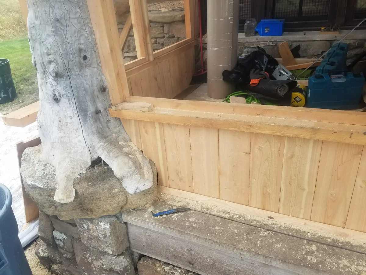 Cedar deck under timber frame pergola
